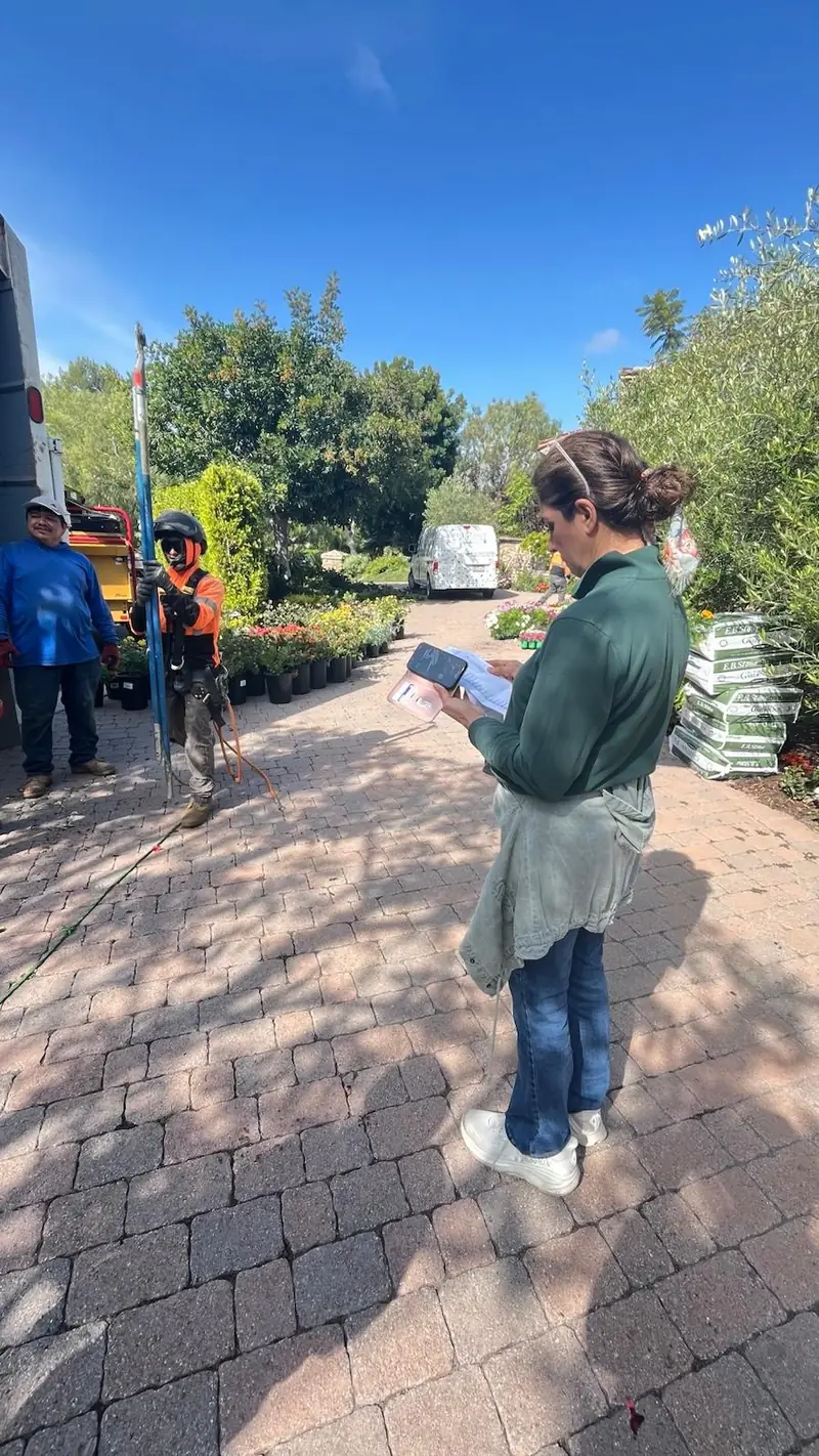 Checking the plant list at the nursery