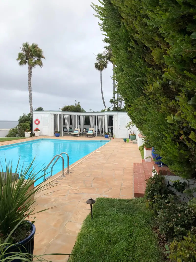 A deep green lawn beside the pool at an oceanfront garden in La Jolla