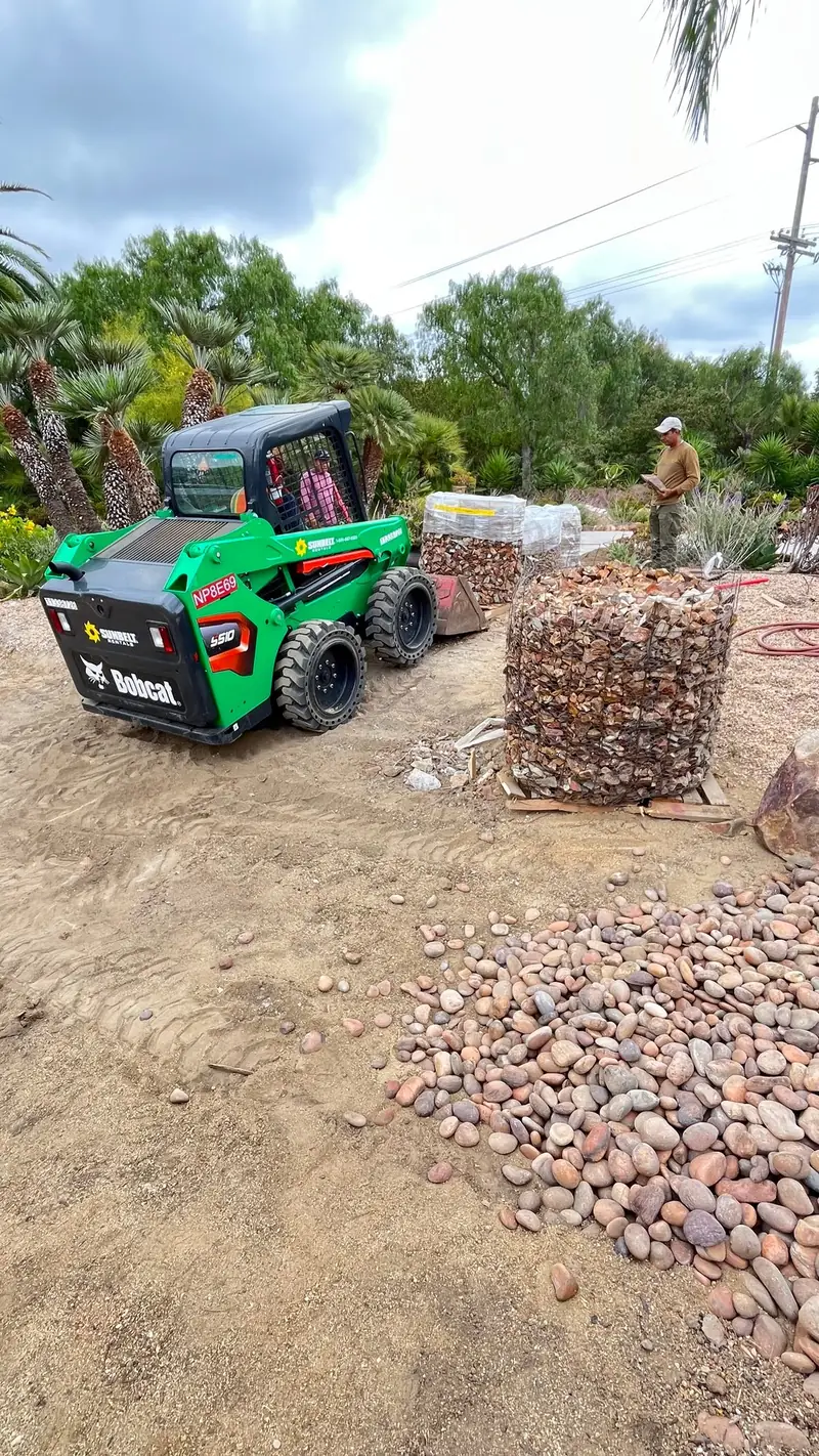 Moving river rock into place