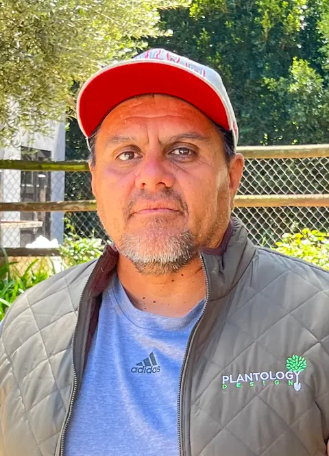 Plantology crew member in a company vest