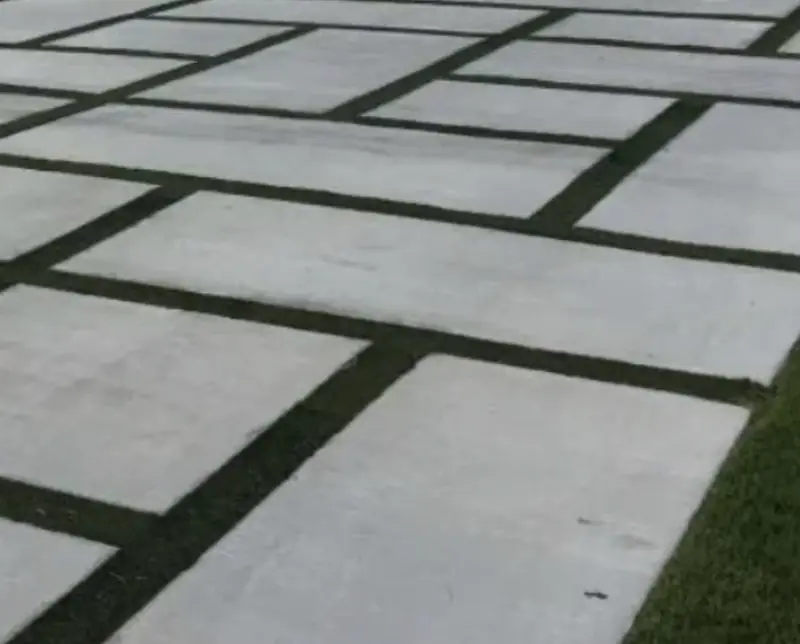 Concrete pavers set in artificial turf