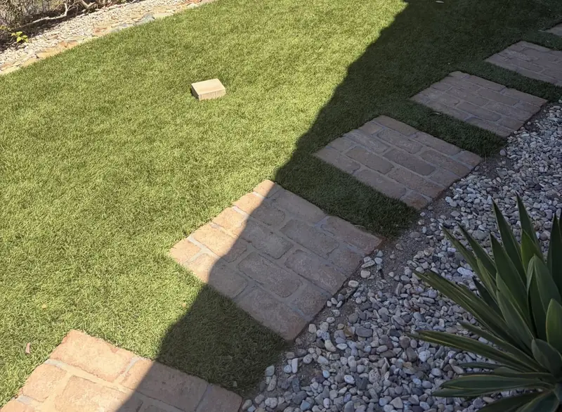Stepping pavers across artificial turf